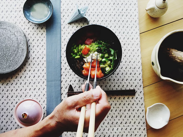 An sushi bowl and chopsticks