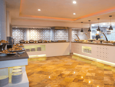 Buffet area with various dishes and plates in Frutas y Flores Restaurant at Buenaventura Grand Hotel and Spa
