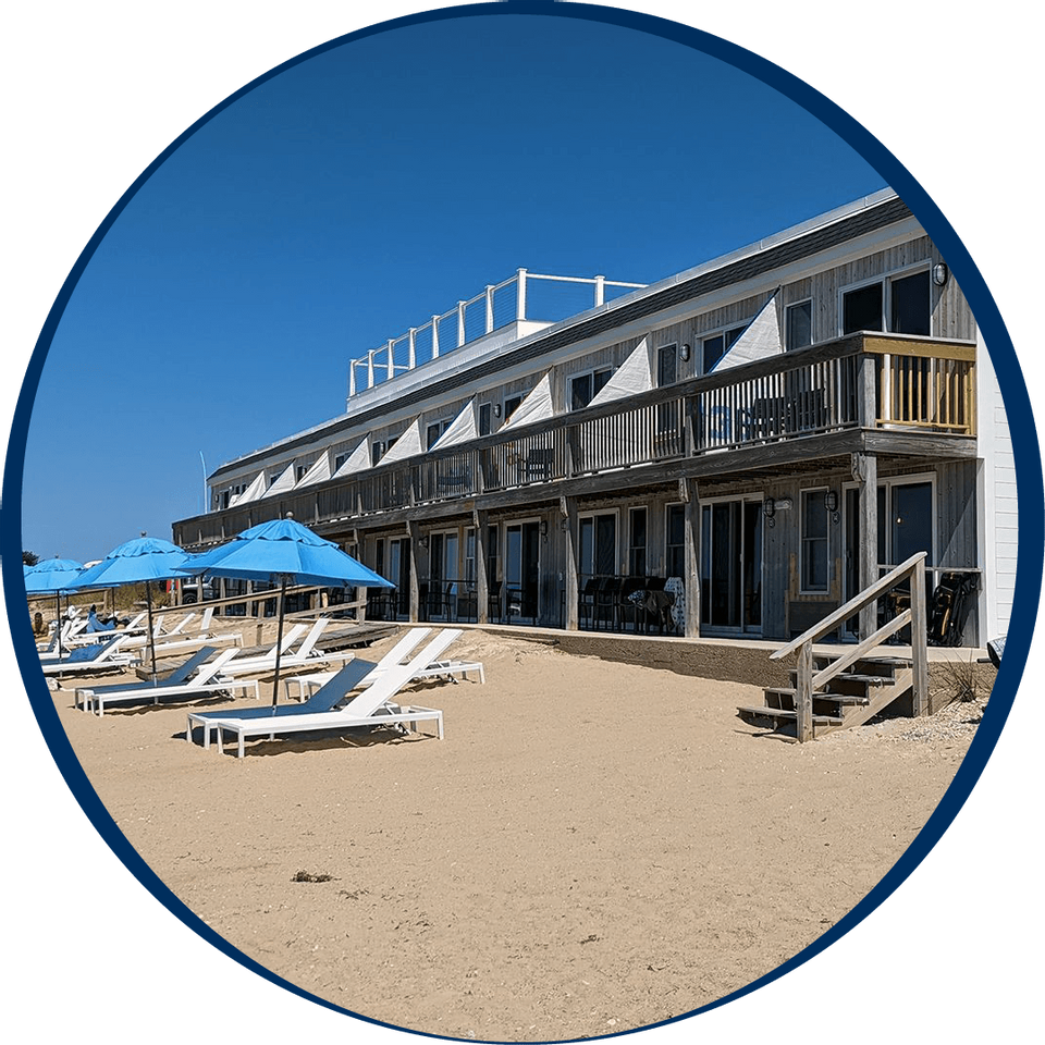 Wooden building & sun lounges on the beach at Falmouth Tides