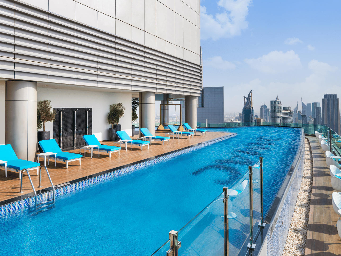 Sun loungers by the pool with city view in Malibu Sky Lounge & Bar at Paramount Hotel Midtown