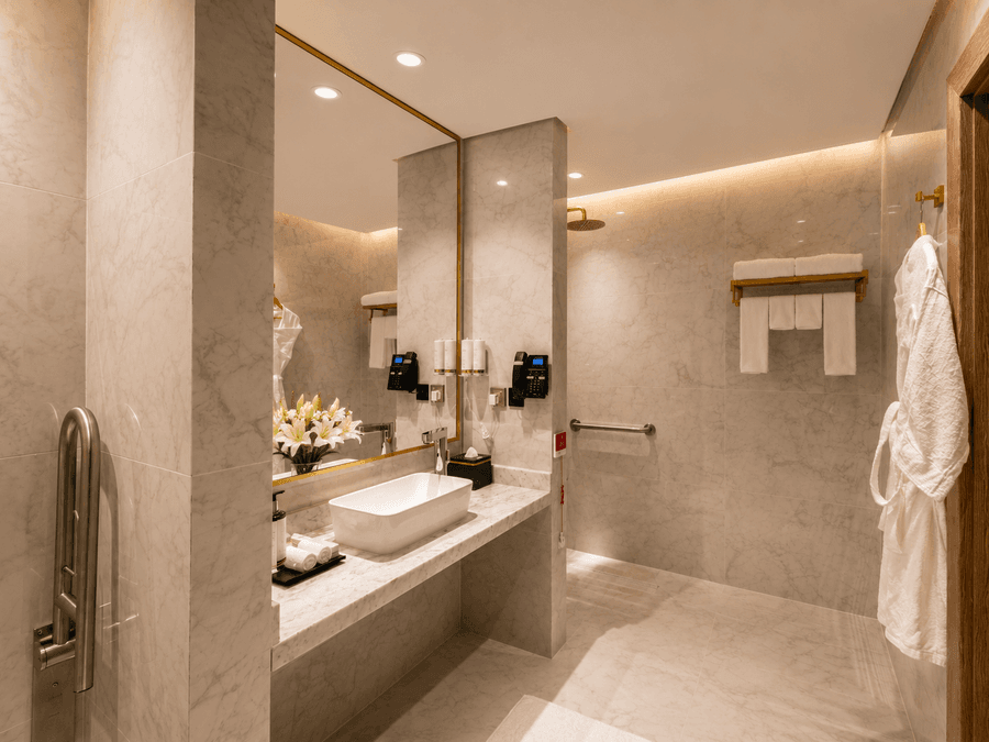 Marble bathroom with vessel sink in Accessible Room at Naviti by Warwick Jeddah, highlighting modern hotel rooms in Jeddah