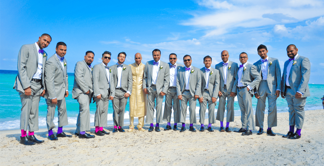 Groom & Batsmen posing by the Beach at The Diplomat Resort