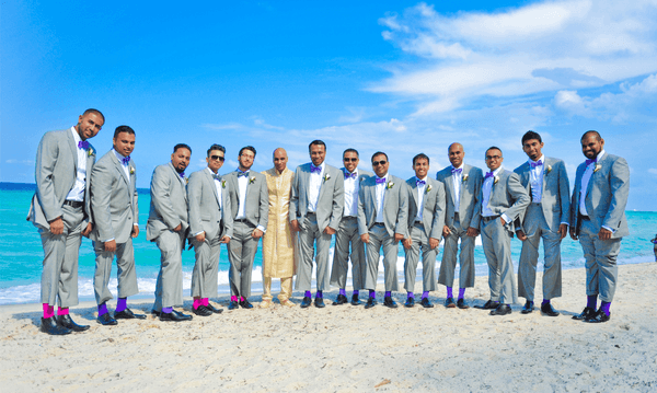 Groom & Batsmen posing by the Beach at The Diplomat Resort