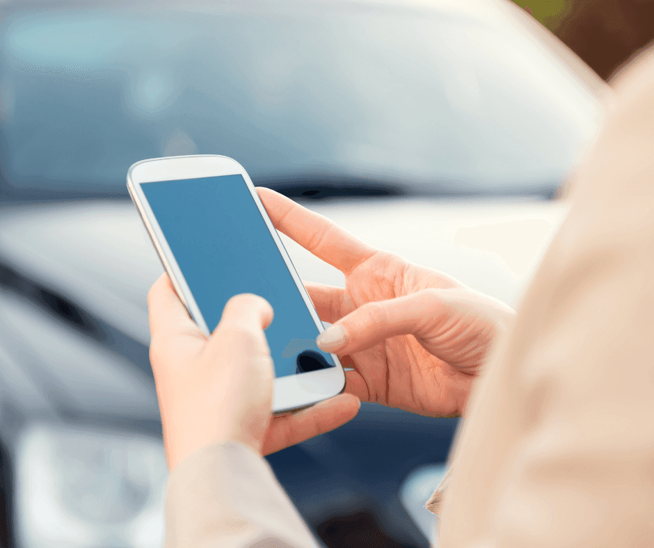 Close-up of a lady using phone near Manteo Resort Waterfront