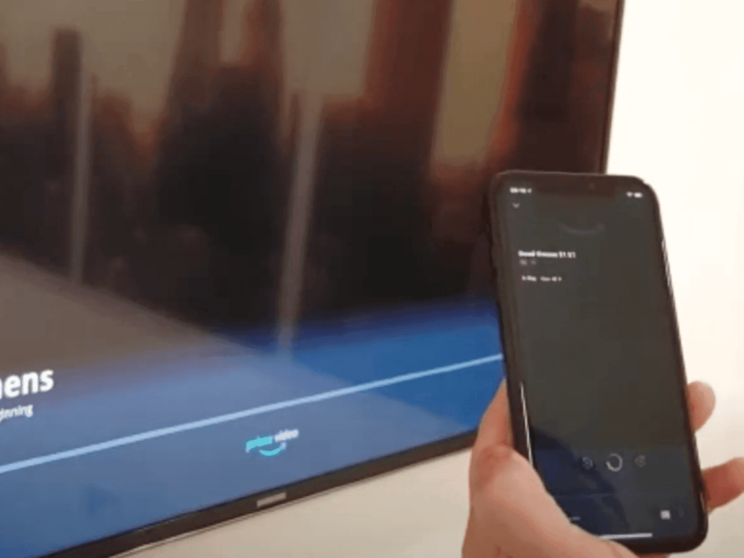 Seamless entertainment with a smartphone casting to the sleek TV in a guest room at Paramount Hotel Portland