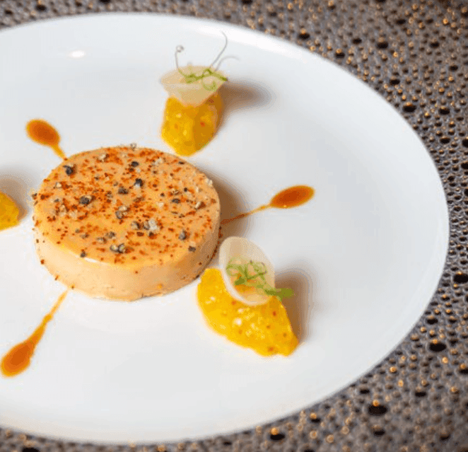A plated gourmet French dish served at L’Atelier
