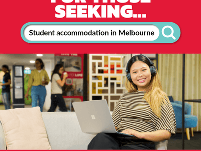 Smiling woman in headphones using laptop on couch at Student Living on Villiers.