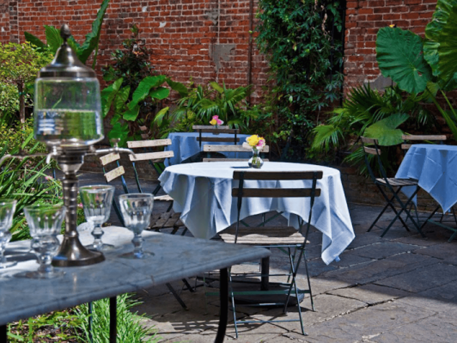 An outdoor dining area at Café Amelie near Hotel St. Pierre