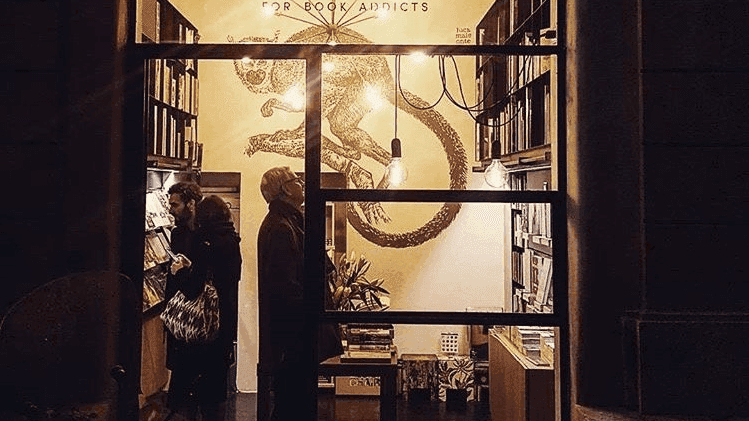 People standing inside the Booktique store near Rome Luxury Suites