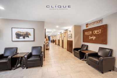 Welcoming lobby of Falcon Crest Lodge features comfortable leather armchairs, artworks