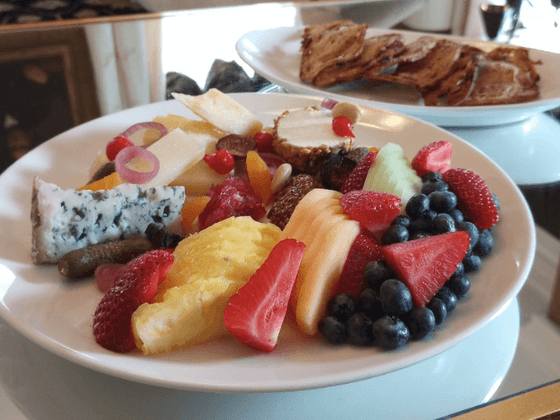 Close-up of cheese and fruit platter on table at the inn at Willow grove