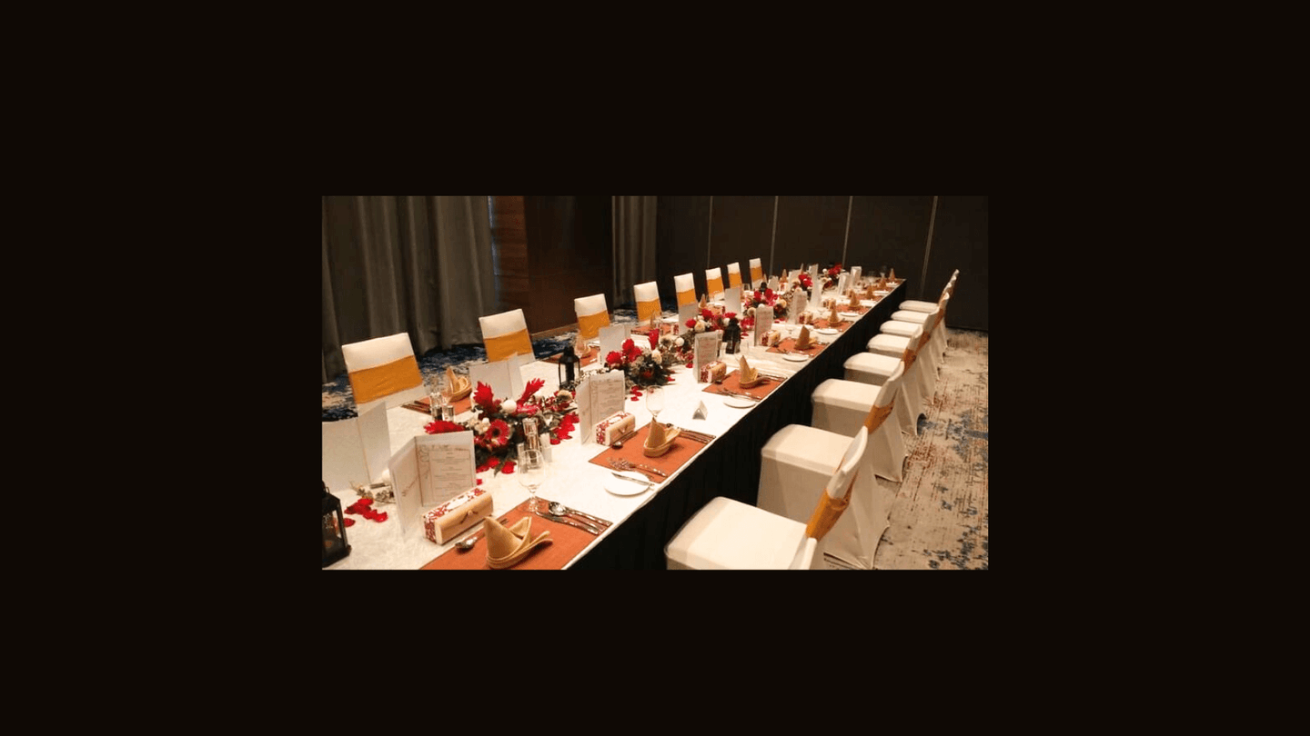 Elegant long dining table with white chairs at Sunway Hotel Big Box