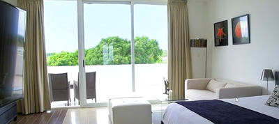 Master Suite with a king bed at Playa Blanca Beach Resort