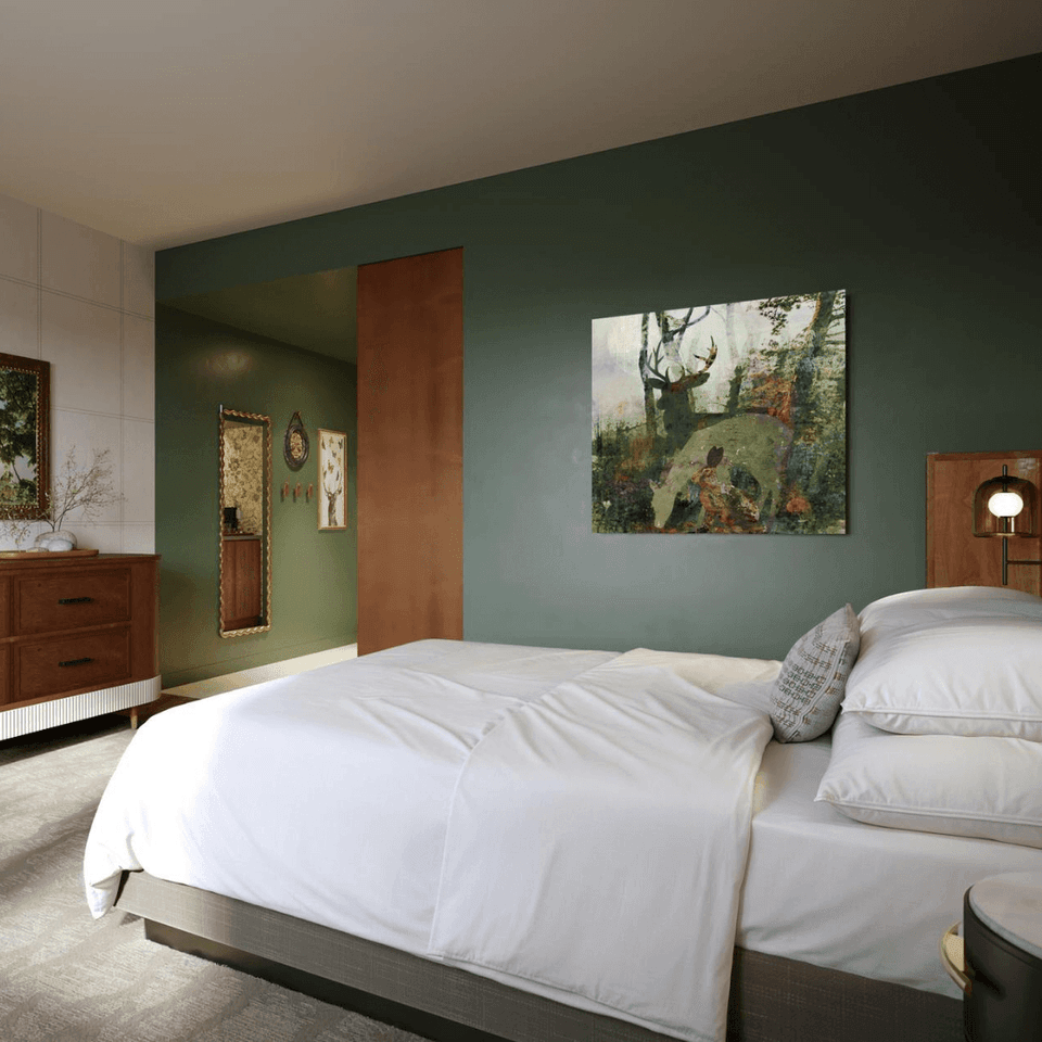 Interior & decor of a bedroom featuring king bed at Hotel Brookmere