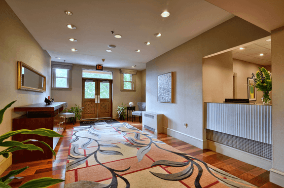 Lobby area with plant decorations at The Centennial Hotel