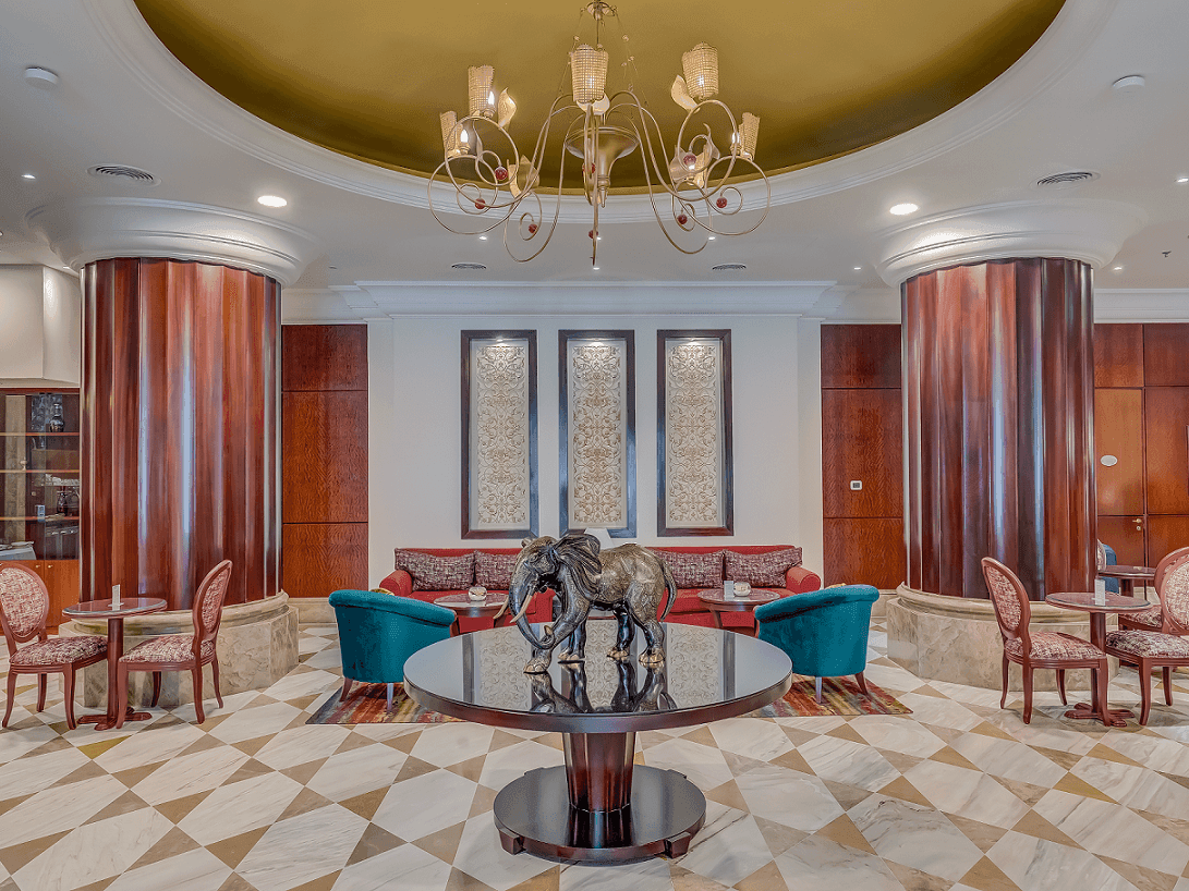 Lounge area with cozy sofa in Lobby Café at City Seasons Hotels