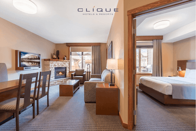 Suite at Falcon Crest Lodge features a dining area, a living room with a fireplace and TV