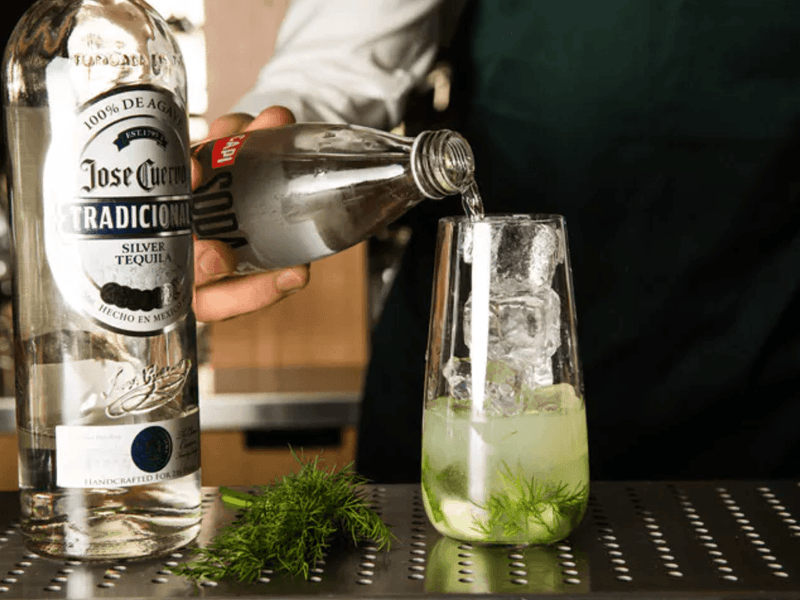 A bartender making a cocktail at Pullman Melbourne City Centre