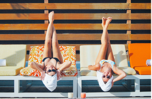 Two ladies lounging on the sunbeds at The Sarasota Modern