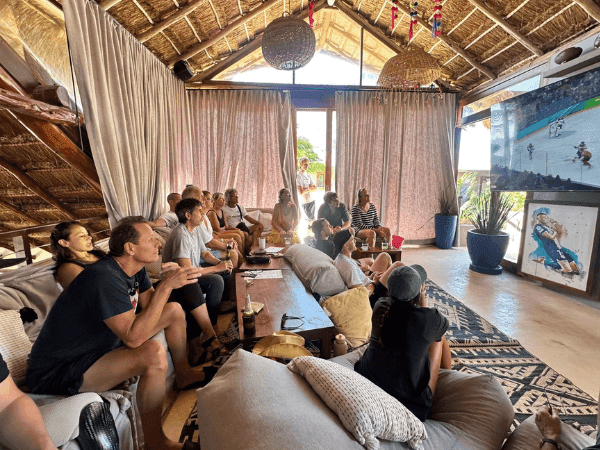 Guests watching sports on a large screen at La Zebra Sports Bar in Tulum at La Zebra Hotel.