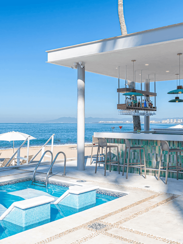 Outdoor pool area with counter in Palmita Snack & Bar overlooking the sea at Buenaventura Grand Hotel and Spa