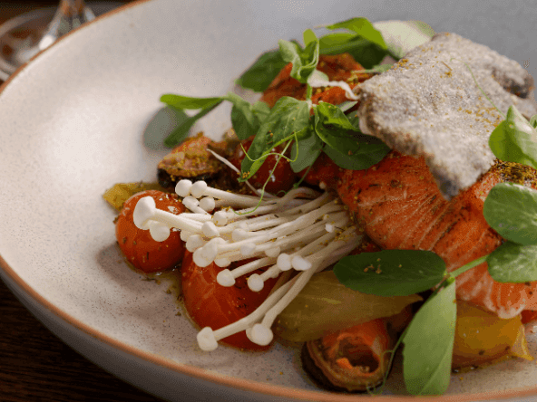 Close-up of a salmon dish served in Bacar Restaurant at Pullman Sydney Olympic Park