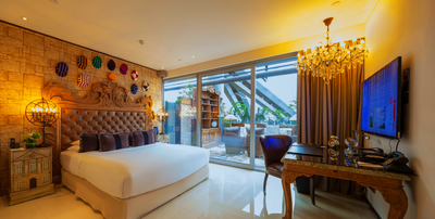 Interior of a room with a king bed at Hotel Eclat Beijing