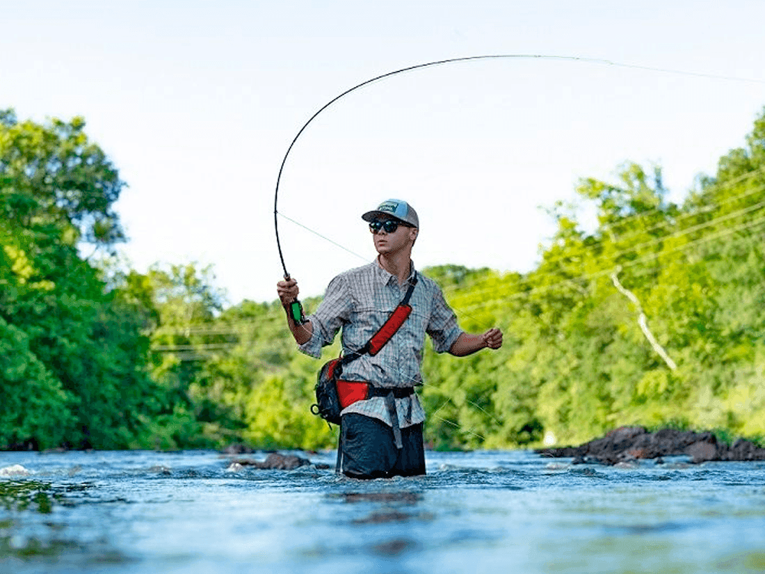 Things to do in orange virginia, a man fishing in a stream surrounded by greenery near Inn at Willow Grove