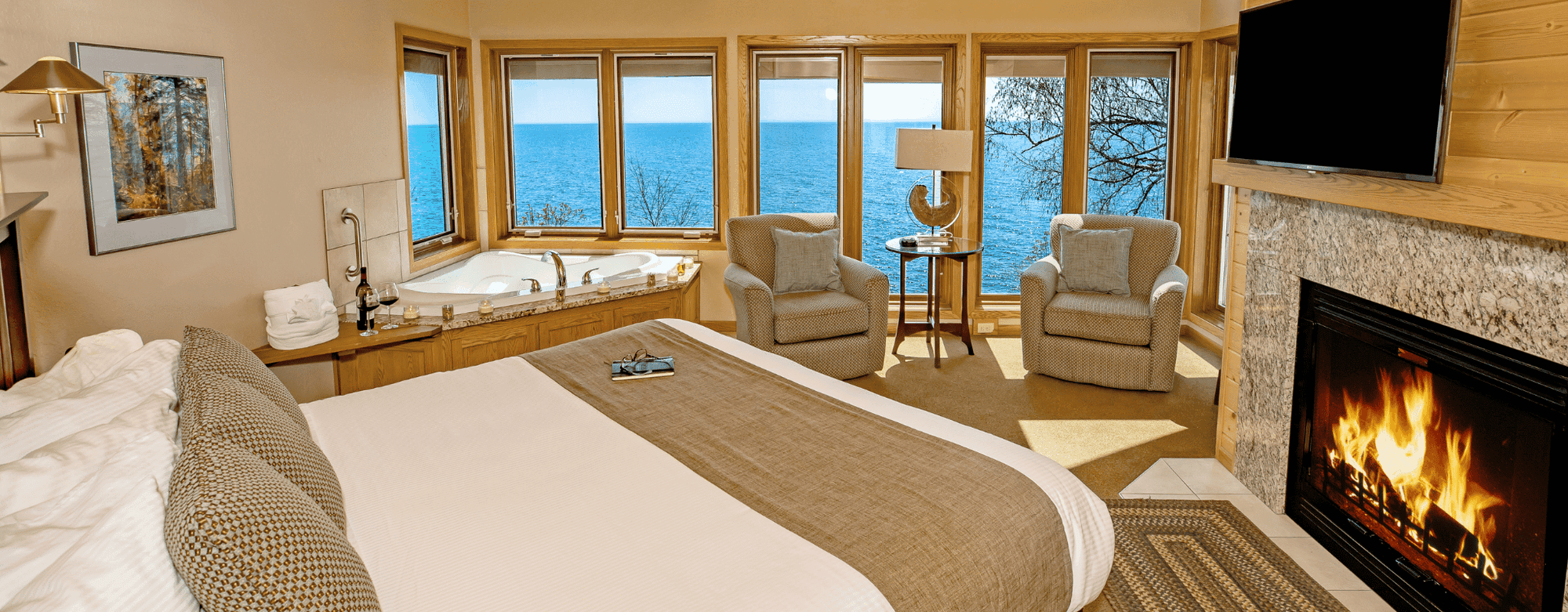 Comfy bed in hotel room at Bluefin Bay Family of Resorts