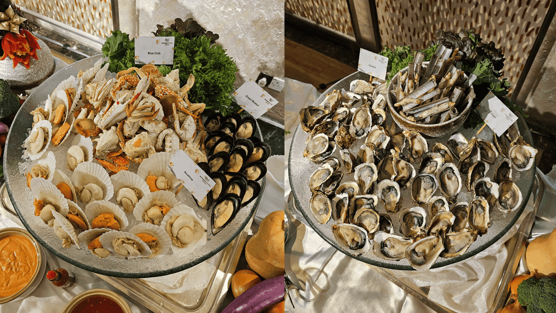 Seafood buffet display with labeled crab, scallops, and oysters on ice served at Sunway Putra Hotel