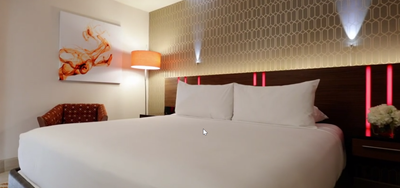 Bed & lounger in West Coast King Room at Hotel Angeleno