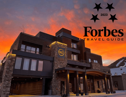 Forbes Travel Guide poster with a hotel background at Hotel Jackson