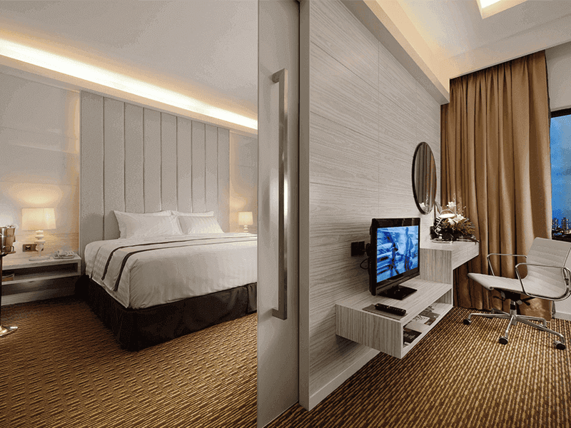 Two king-size beds and TV in A Basic One Plus Twin at Sunway Putra Hotel