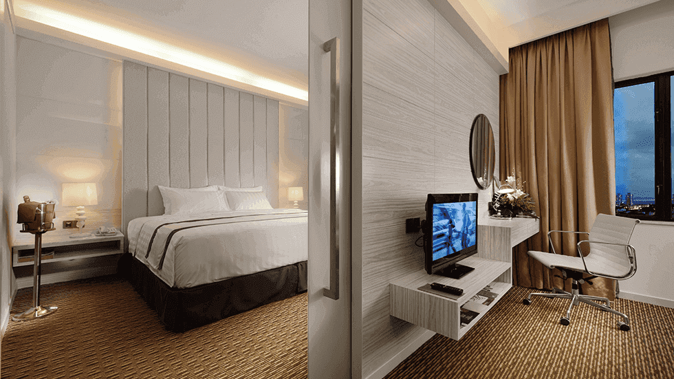 Two king-size beds and TV in A Basic One Plus Twin at Sunway Putra Hotel