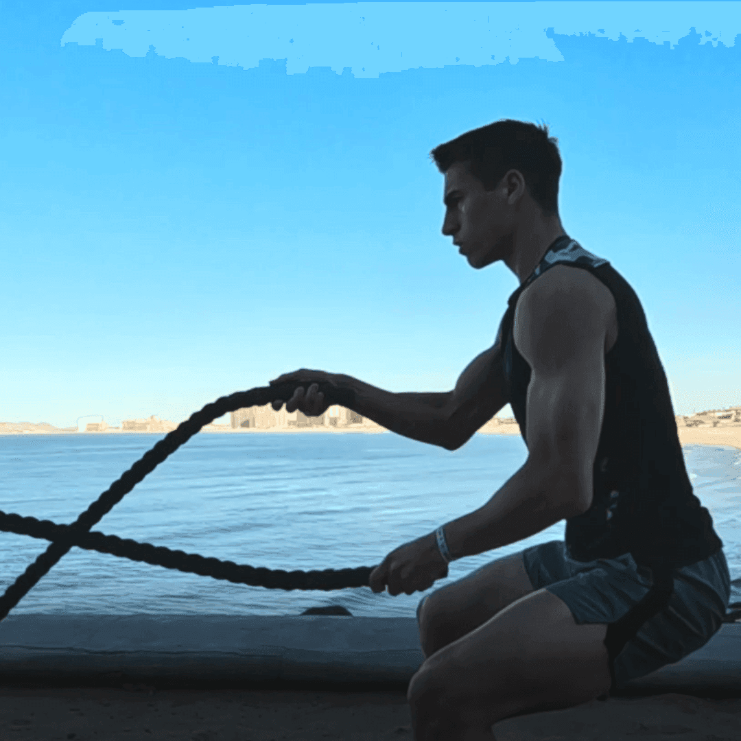 Man engaged in battle rope exercise at Penasco del Sol