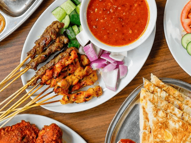 Satay dish served on table in Mamak restaurants at Brady Hotels Central Melbourne