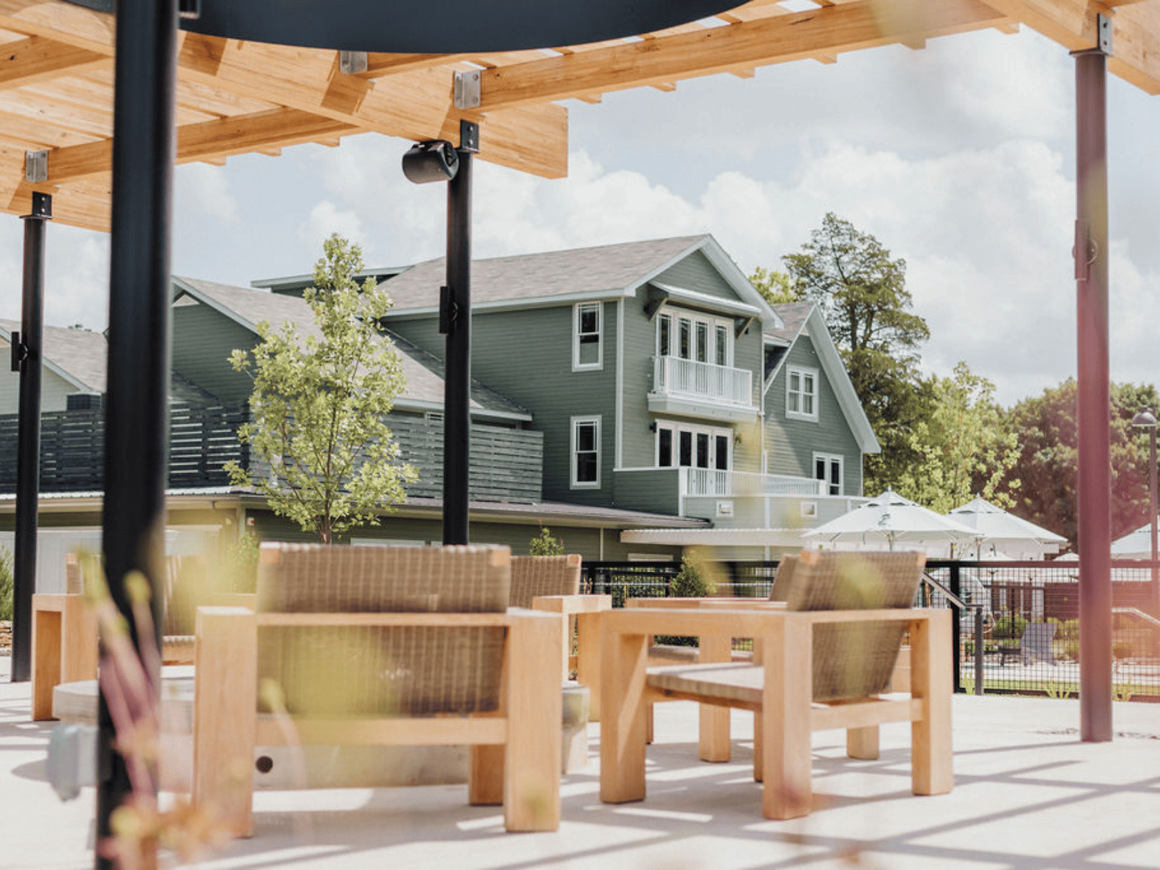 A patio at the Stonebreaker Hotel with refinded seating and outdoor firpit.