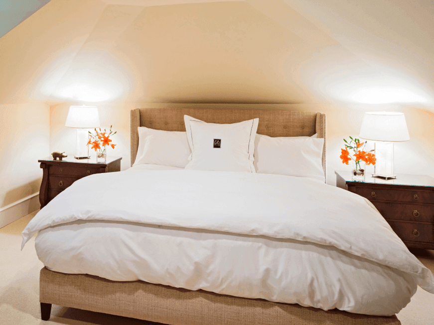 The Loft room with comfy bed and two side lamps in Inn at Willow Grove