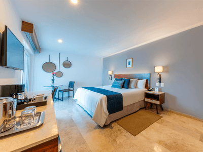 Deluxe King Bed with TV, coffee machine and work desk at Buenaventura Grand Hotel and Spa