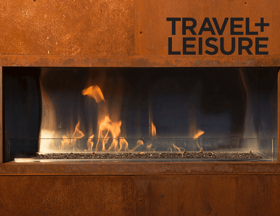 Travel + Leisure poster with a fireplace in the background at Hotel Jackson
