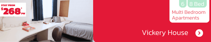 Comfortable student room at Vickery House with desk, shelving and natural light – shared 6-8 bed apartments from $268 per week.
