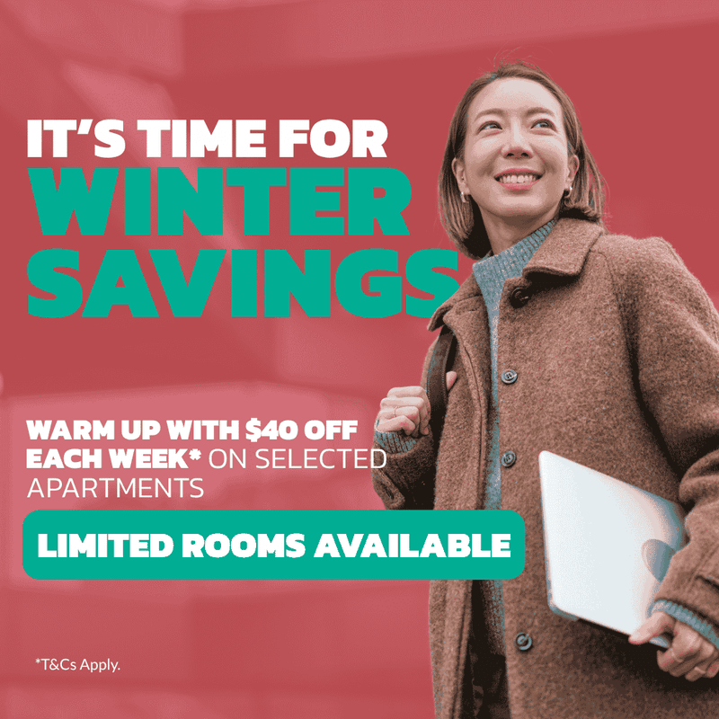 Smiling student in brown coat holding coffee cup with winter savings promotion for Student Living - City West