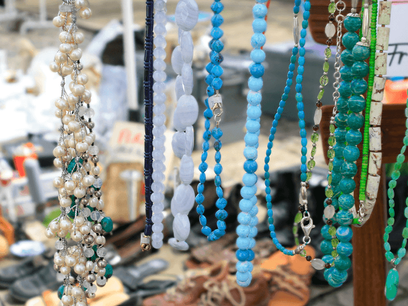 Colorful handmade beaded necklaces and jewelry displayed at Margaret River Town Square Markets outdoor vendor stall