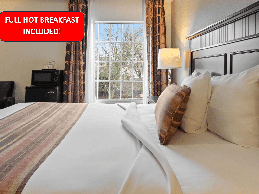 Bedroom with an outdoor view in King Superior With Sofa Bed at The Wilshire Grand Hotel