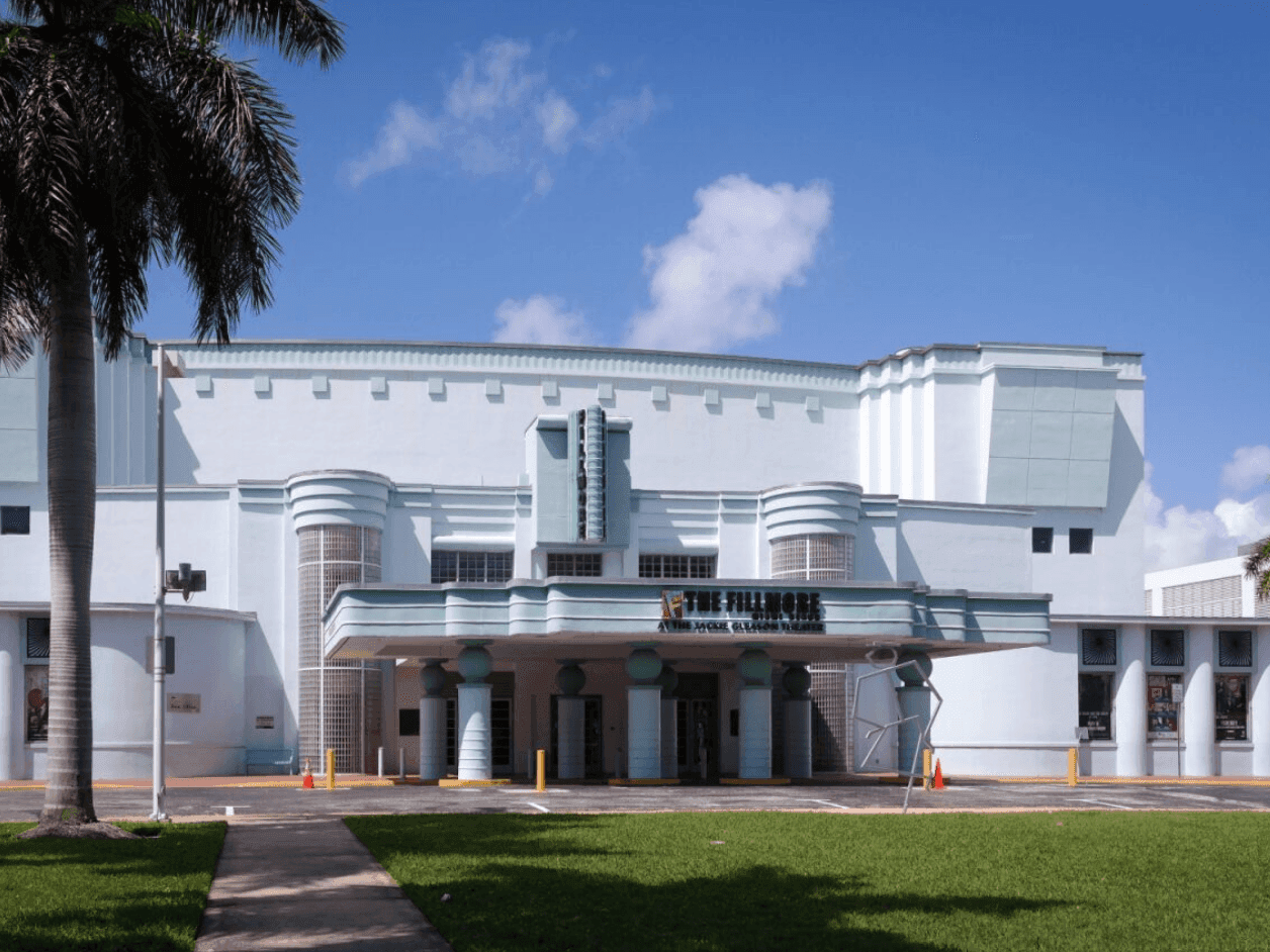 Front entrance of Jackie Gleason Theatre Fillmore Miami Beach on a sunny day near Tradewinds Apartment Hotel