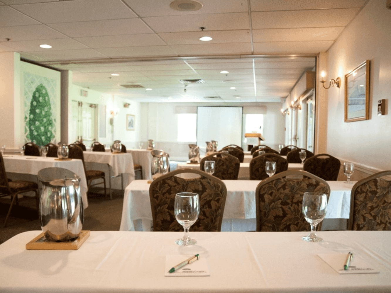 Classroom type set up with glassware in the Cathance Room at Harraseeket Inn