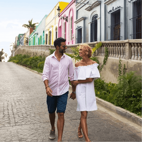 Couple walking in historic district, Viaggio Resort Mazatlan