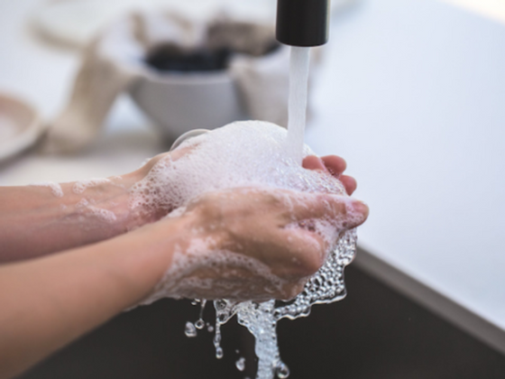 Closeup of a man washing his hands at  Richmond Hill Hotel
