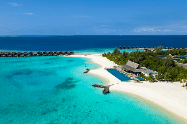 Grand Park Kodhipparu Maldives Drone shot of the Breeze Poolside Dining and Bar showing Pool and overwater villas