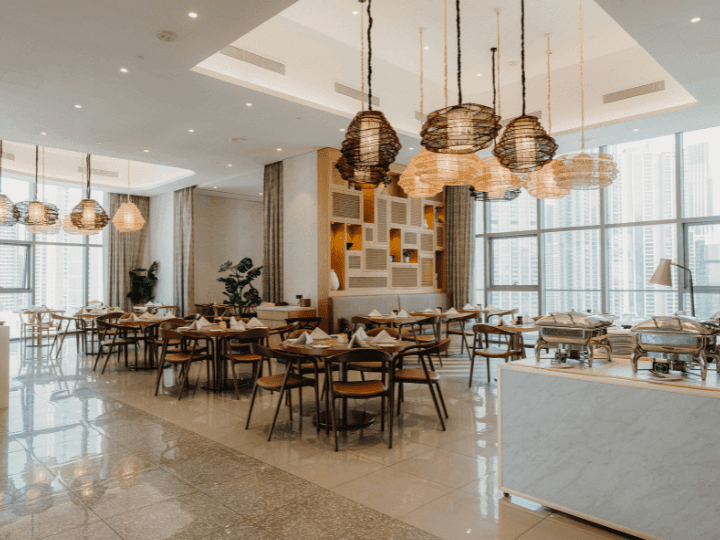 Dining tables arranged in CineScope Restaurant at Paramount Hotel Midtown